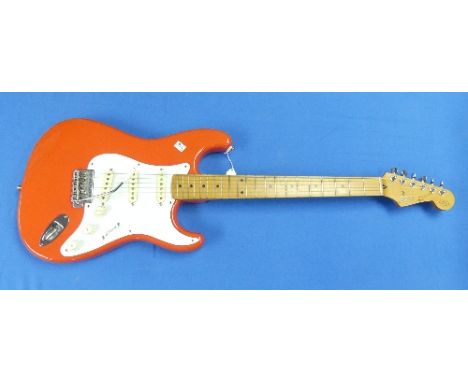 A Squier by Fender Hank Marvin signature Stratocaster electric guitar, Fiesta red, serial no. L020405, made in Japan, with so