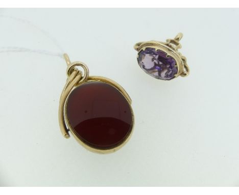A 9ct gold oval Swivel Fob, set with bloodstone and carnelion, together with an amethyst coloured fob in unmarked yellow meta