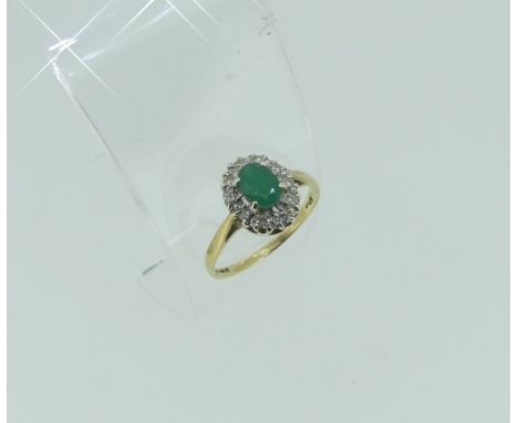 A small oval emerald and diamond cluster Ring, the shank in yellow gold marked 375, Size N, together with a half hoop ring, s