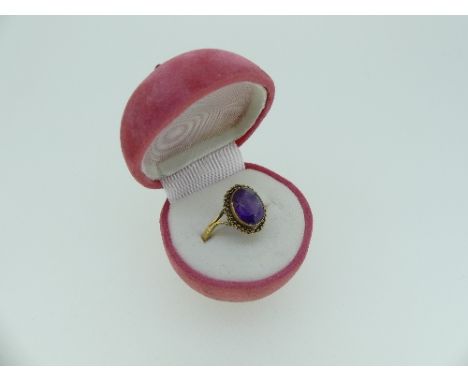 A 9ct rose gold narrow gatelink Bracelet, approx weight 9g, together with an oval amethyst ring, the plain shank marked 375 (