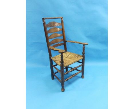 A late 19th century Lancashire oak ladder-back Armchair, with rope seat.