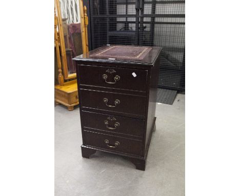 A MODERN DARK WOOD FILING CABINET, THE TOP WITH CLARET LEATHER INSET AND GILT DETAIL, THE DRAWERS FOR A4 DOCUMENTS STYLED AS 