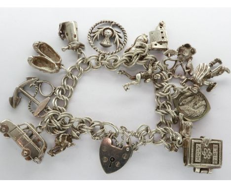 Hallmarked silver charm bracelet with padlock clasp, safety chain and fifteen charms, L: 18 cm, 54g. UK P&amp;P Group 1 (£16+