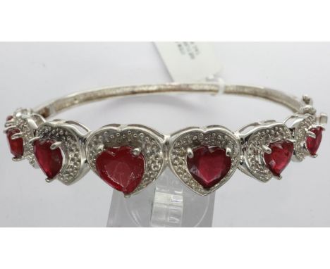 925 silver bangle set with seven heart shaped rubies, D: 70 mm. UK P&amp;P Group 1 (£16+VAT for the first lot and £2+VAT for 