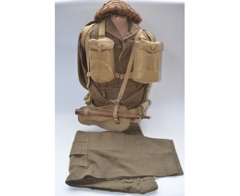 British Army uniform, jacket size 13 1949 pattern (1955), with trousers (size 5), helmet, entrenching tool, webbing etc. Comp