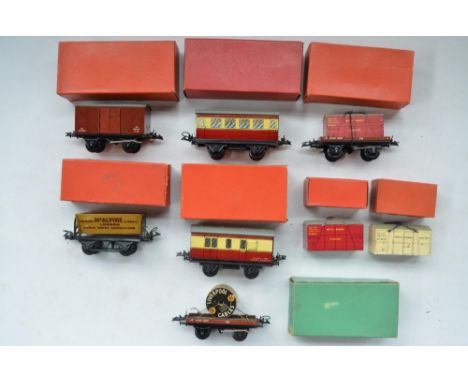 Eight boxed Hornby Trains O gauge passenger and goods wagons to include Rotary Tipping Wagon, Low sided wagon With Cable Drum