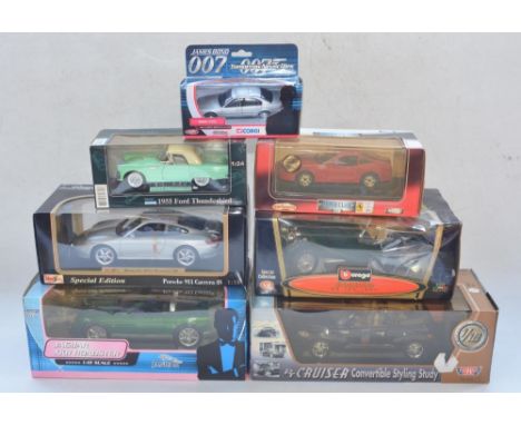 Four boxed 1/18 diecast model cars to include Burago Jaguar SS100 (1937), James Bond Jaguar XKR Roadster (The Beanstalk Group