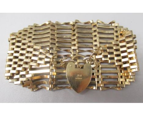 9ct yellow gold tapering 14 bar gate bracelet, with heart padlock clasp, stamped 375, 24.6g 