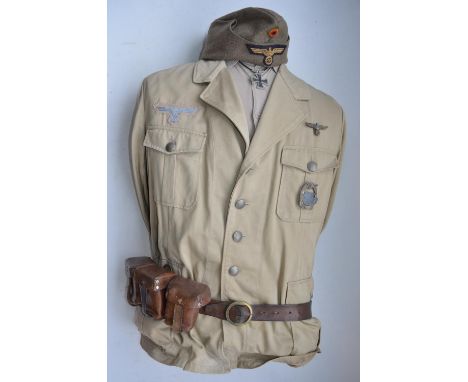 German Afrika Korps jacket by Marquarot &amp; Schulz, cap, leather belt and ammunition pouches. Complete with mannequin for e