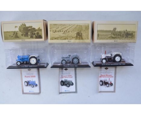 Twenty diecast small scale model tractors/agricultural machinery by Hachette Partworks and 3x Atlas Editions tractor models 