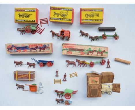 Collection of small diecast metal farm wagons and accessories from Moko Toy Farmette and Benbros Mighty Midget series, mostly