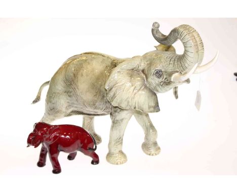 Large Goebel model of an elephant and a Royal Doulton Flambé model of an elephant (2)