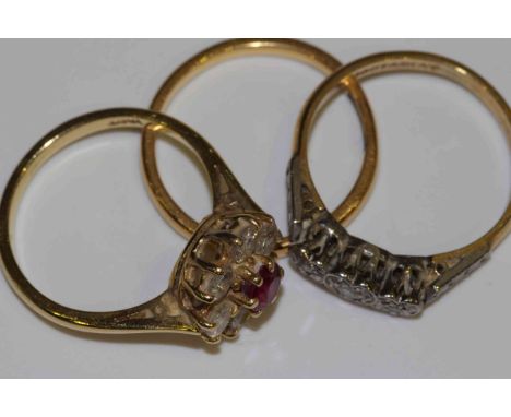 18 carat gold, platinum and diamond ring; 18 carat gold, ruby and diamond cluster ring; and a 22 carat gold band (3) gross 7.