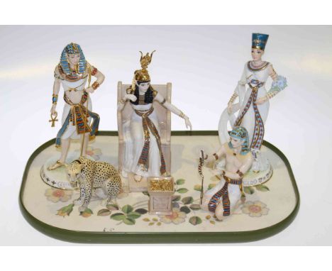 Collection of Egyptian themed figures including Royal Worcester and Coalport