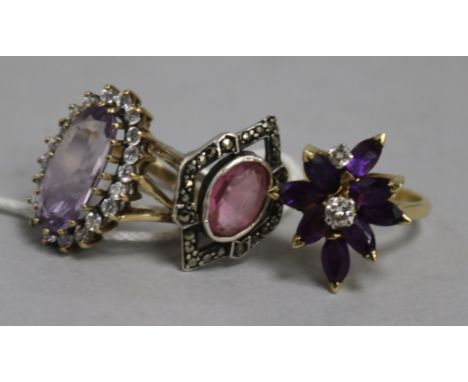 Two amethyst and diamond rings and a marcasite ring