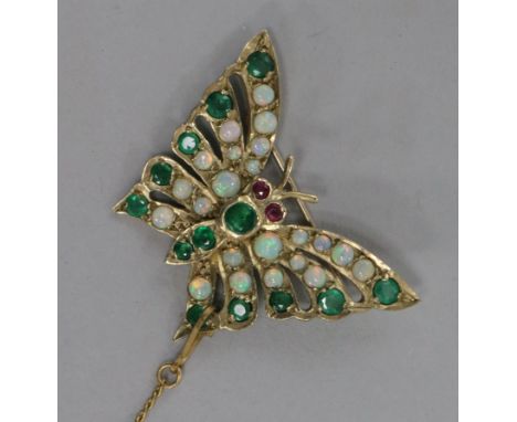 A gold, emerald and opal butterfly brooch 3.5cm.