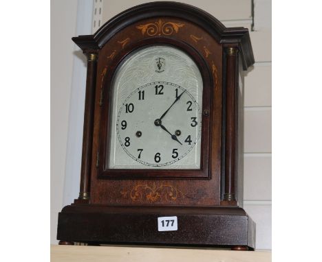 A mahogany and marquetry mantel clock