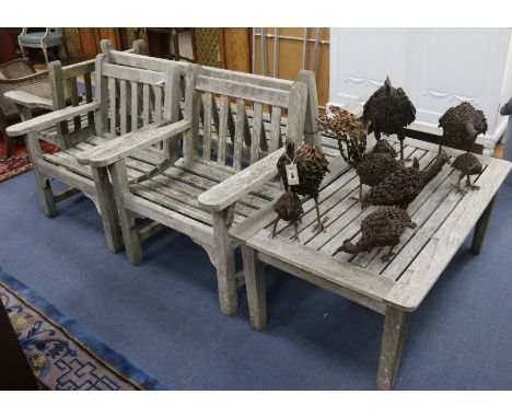 A Teak garden bench, 3 armchairs and a table W.161cm