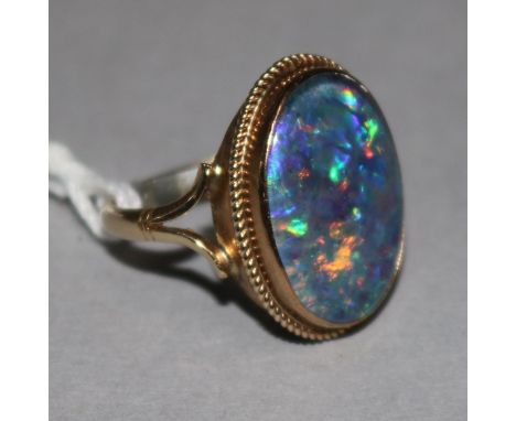 A 9ct gold black opal doublet ring