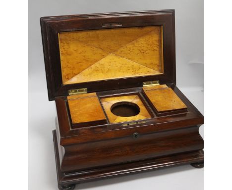 A rosewood sarcophagus tea caddy