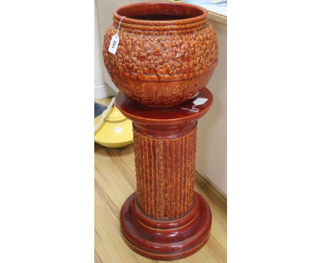A Burmantofts Faience sang-de-boeuf jardiniere on stand, model numbers 1570 and 1211, H 35in (bowl a.f.)