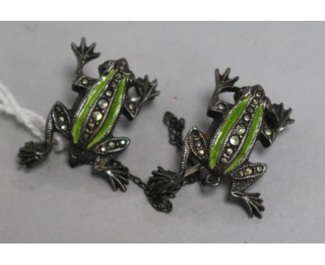 A pair of silver enamel and marcasite frog brooches each 2.5cm.