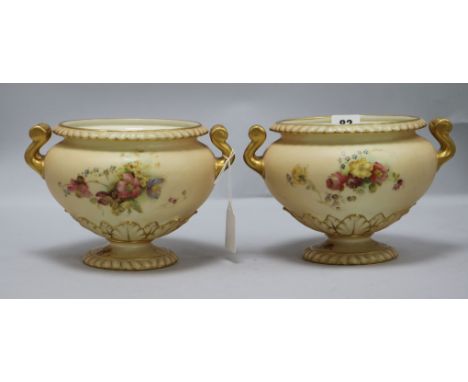 A pair of Royal Worcester blush ivory two-handled vases