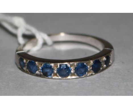 An 18ct white gold seven stone sapphire ring