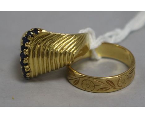 An 18ct gold band and a gold and sapphire ring