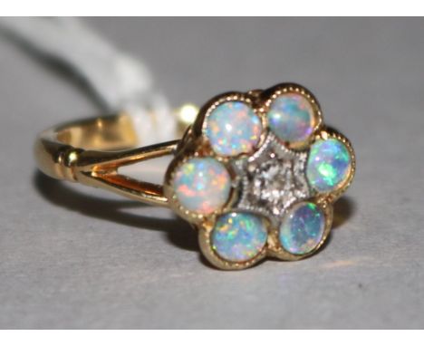 An 18ct gold opal and diamond ring