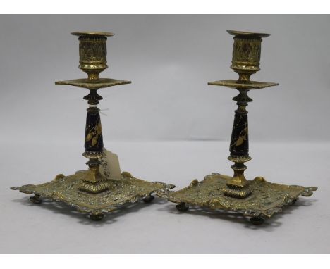 A pair of French brass and enamel candlesticks