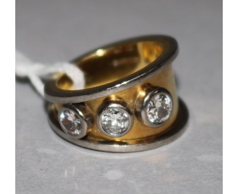 An 18ct gold three stone diamond ring