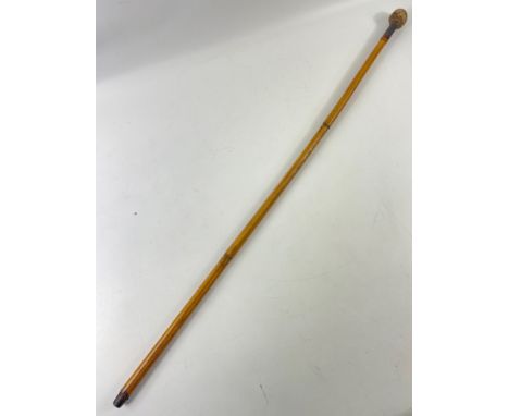 A VINTAGE Walking cane stick with a spherical hand grip made from rope - dimension 85cm - came from a gentleman from overseas