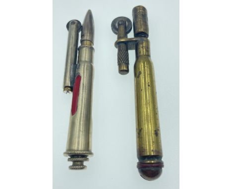 Two examples of TRENCH ART LIGHTERS, the first being WWl brass and the second being post-WWll white metalApprox 2 pieces