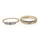 A 375 stamped yellow gold wedding band with a three score multiple design ring size N weight 2g