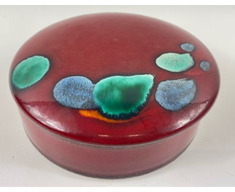 A striking vintage POOLE POTTERY trinket dish with lid in a vibrant red with green/blue highlights 14cm dia, 4.5cm heightAppr