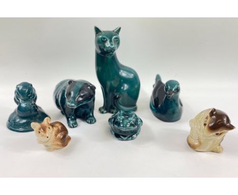 A small collection of POOLE POTTERY land animals to include a cat (17cm), a badger (10cm tall), a bird (16cm long), a blue fi