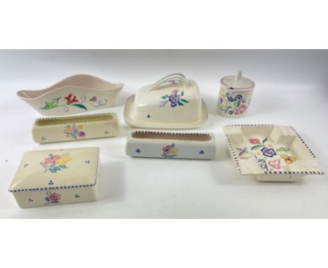 A collection of vintage POOLE POTTERY tableware in a floral pattern to include a cheese dish (19cm long x 12cm high approx), 