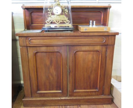 An early Victorian mahogany chiffonier, the raised back with brass gallery shelf and turned supports over a long drawer and a