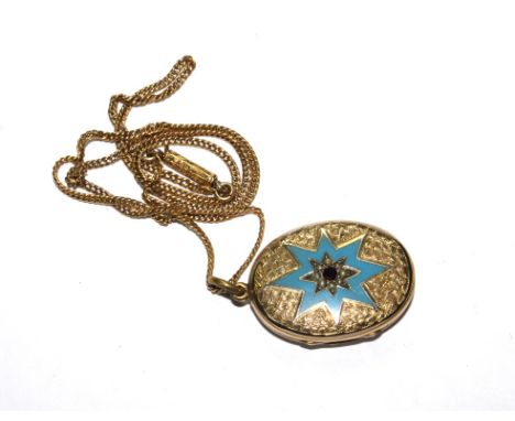 A gold colour locket decorated with blue enamel star on gold colour chain