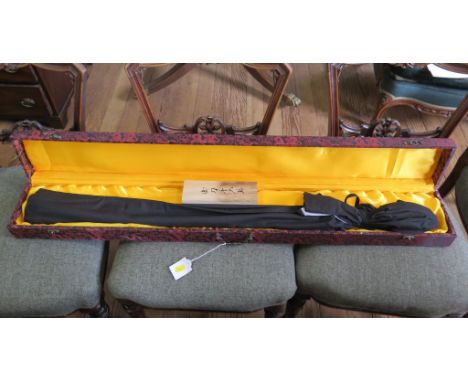 A modern Samurai sword in blue scabbard and binding, cased with accessories