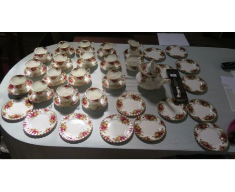 A Royal Albert Old Country Roses pattern part tea service, including teapot and cheese knife, (50 pieces)