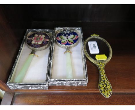 Two Chinese small hand mirrors with cloisonne floral and butterfly design with jade handles each in box and another enamel (3
