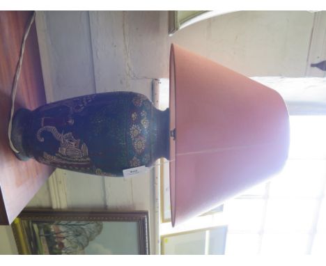 A cloisonne vase depicting a guru on an elephant, with attendants, converted to a table lamp 33cm high