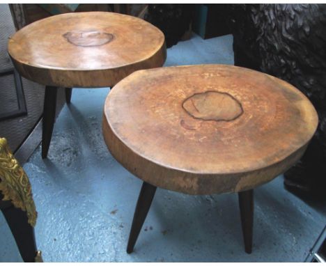 LOW TABLES, a pair, in the form of a section of a tree trunk, each raised on four supports, each approximately 66cm W x 53cm 