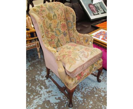 WINGARM CHAIR, early 20th century walnut of compact proportions in a tapestry finish, on cabriole supports, 63cm W x 102cm H 