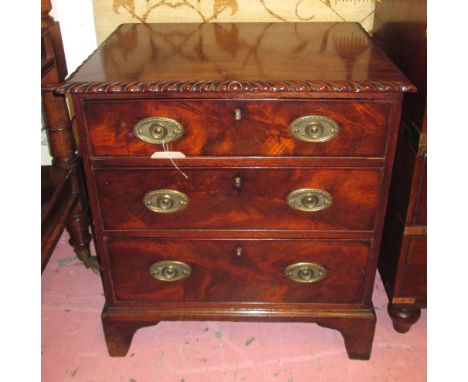 CHEST, George III mahogany of compact proportions with a gadrooned carved edge over three drawers with bracket supports, 66cm