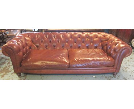 CHESTERFIELD SOFA, brown leather upholstered with buttoned back and two seat cushions, 255cm W x 115cm D. (with faults, one f