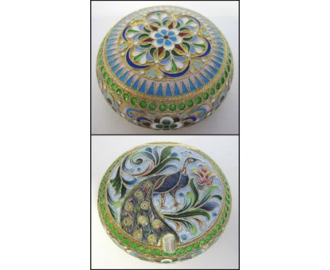 RUSSIAN PILL BOX, silver with all over colourful enamel decoration, the hinged lid with detail depicting a peacock, gilt inte