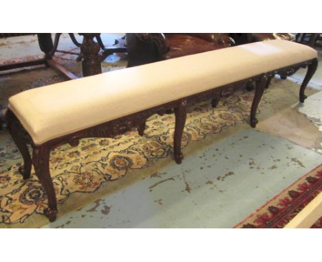 LONG STOOL, of large proportions with linen upholstery on cabriole supports, 240cm x 53cm H.